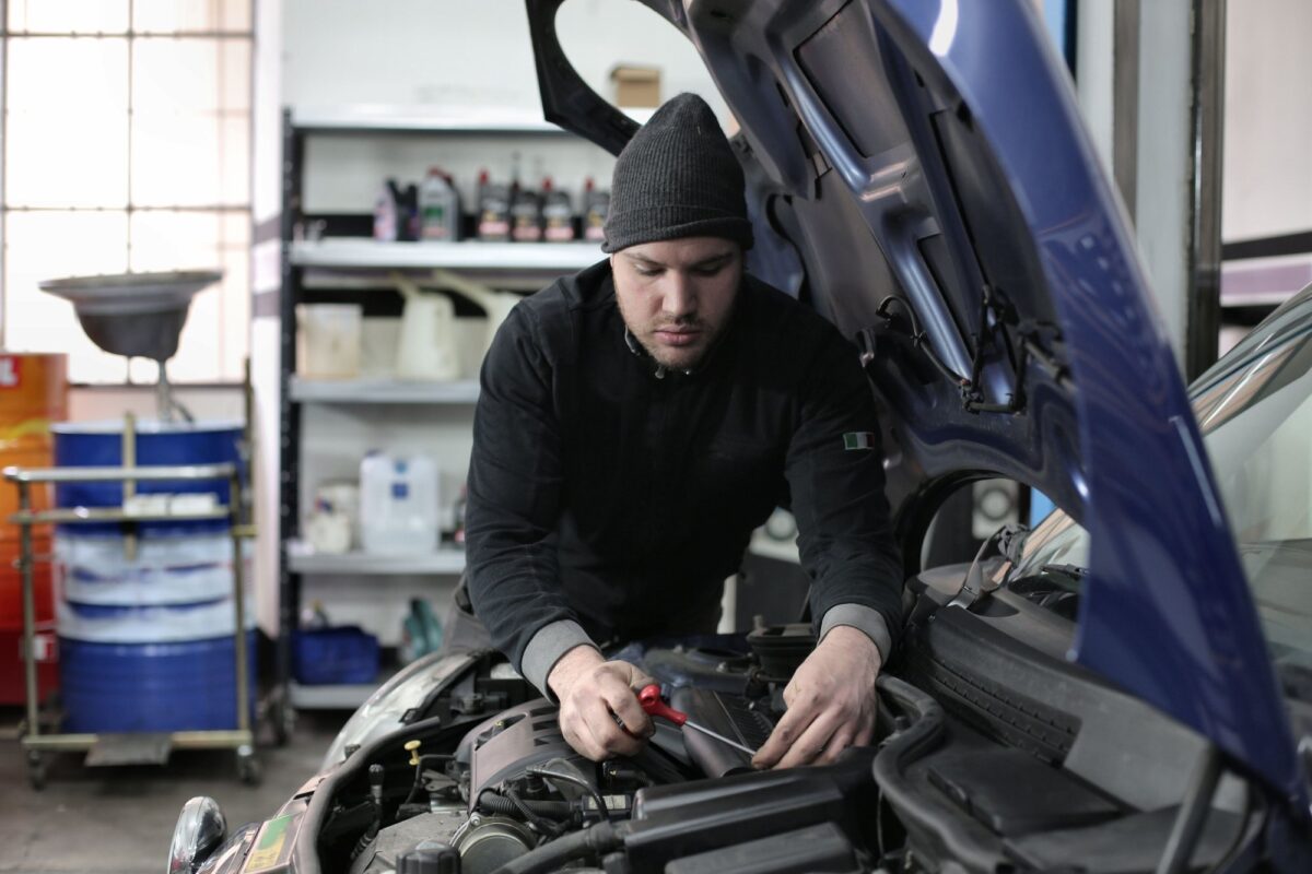 Mechanic working under the bonnet