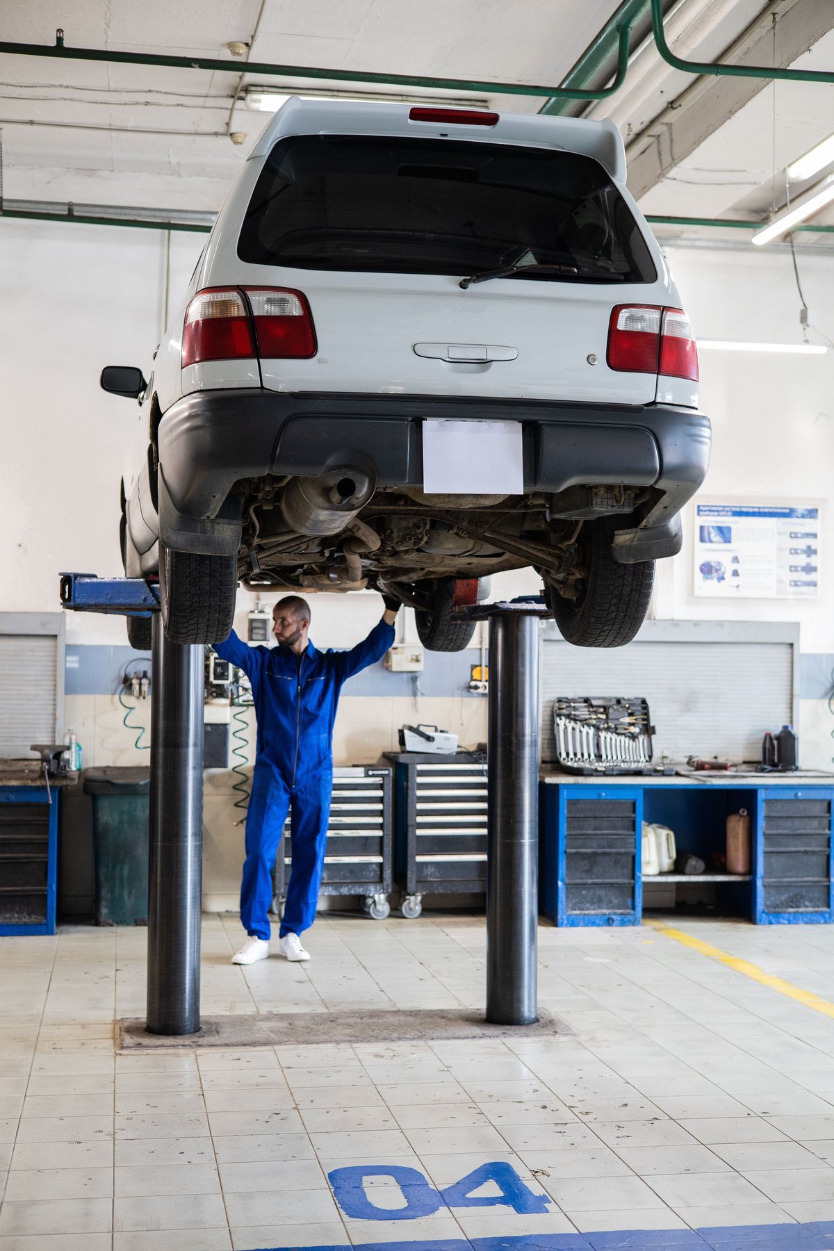 Vehicle on the two-post lift in the workshop